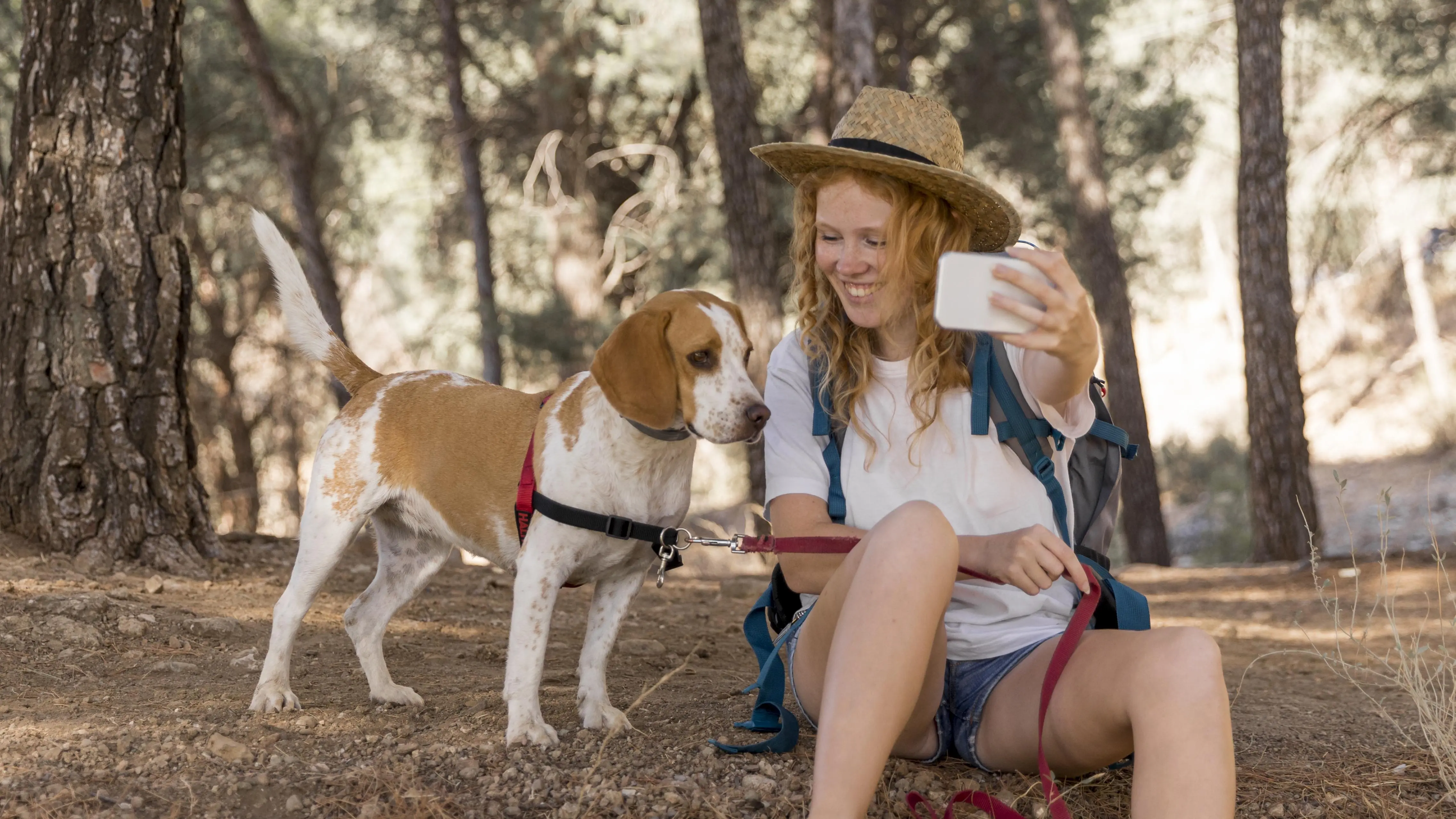 woman-her-dog-having-good-time-taking-selfie